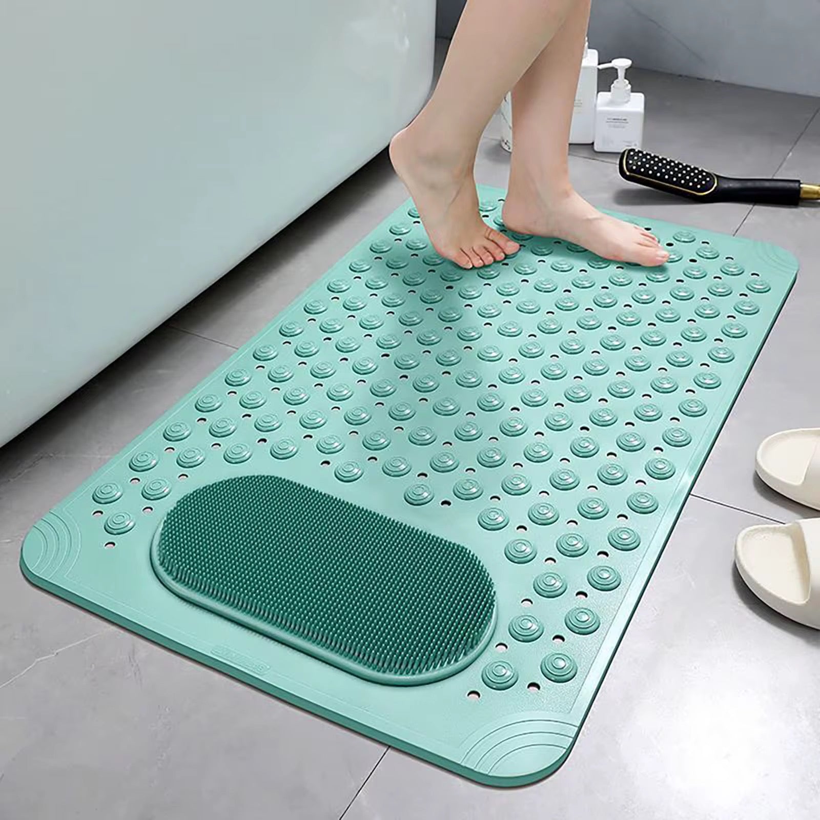 Green textured bath mat on a bathroom floor with a person stepping onto it.