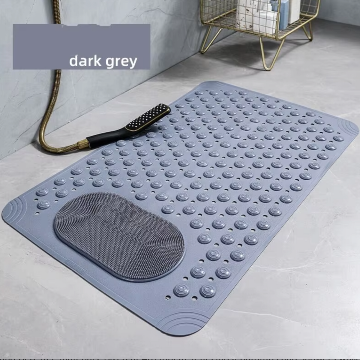 Dark grey bath mat with textured surface on a bathroom floor.