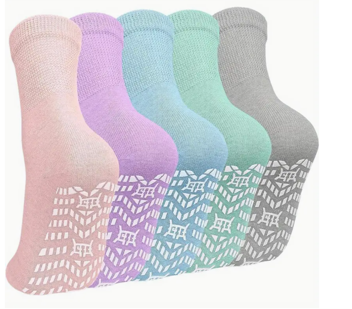 Anti-slip socks in multiple colours showing grip pattern on soles