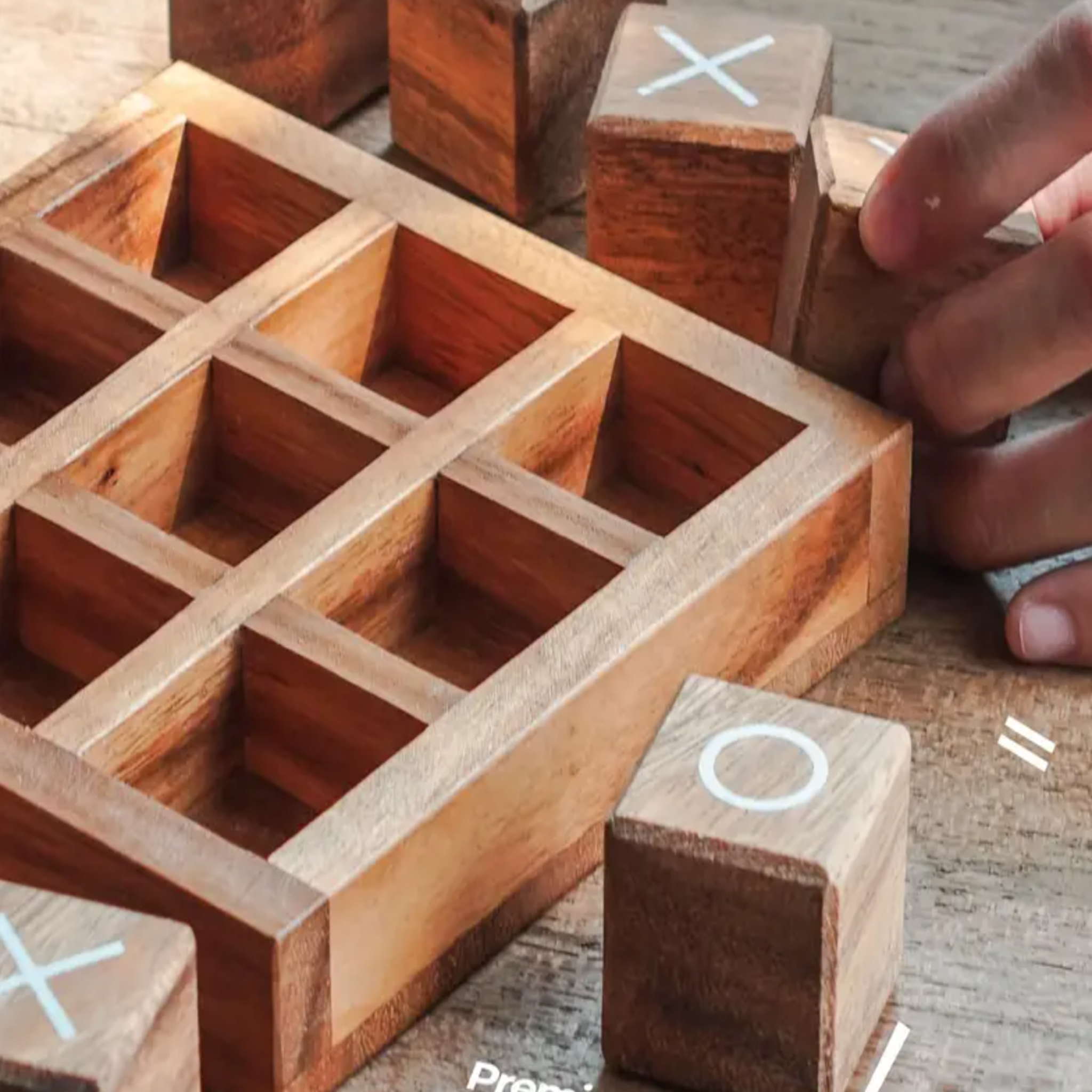 Wooden block puzzle with interlocking pieces on a wooden surface