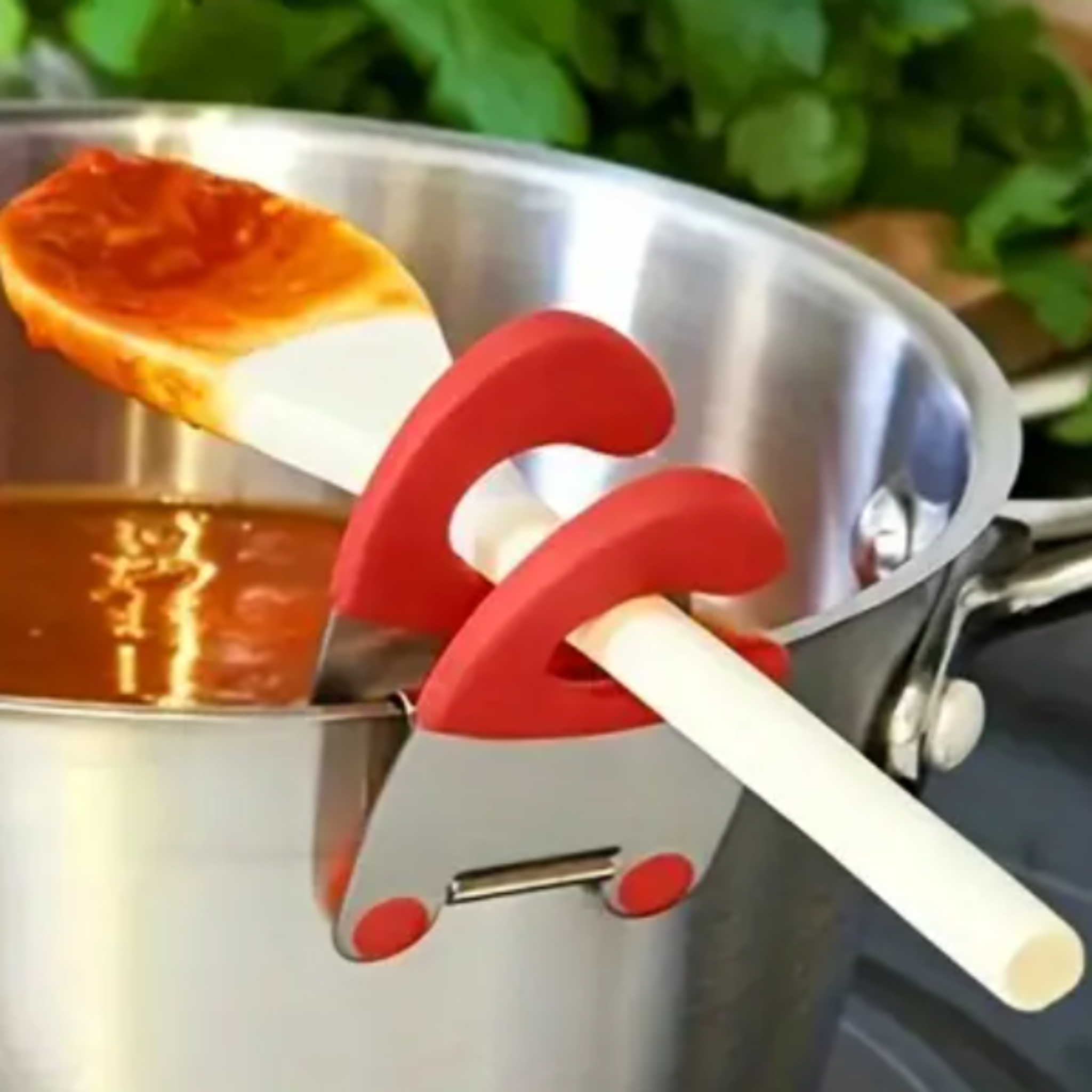Stainless steel utensil holder organising cooking tools on kitchen counter