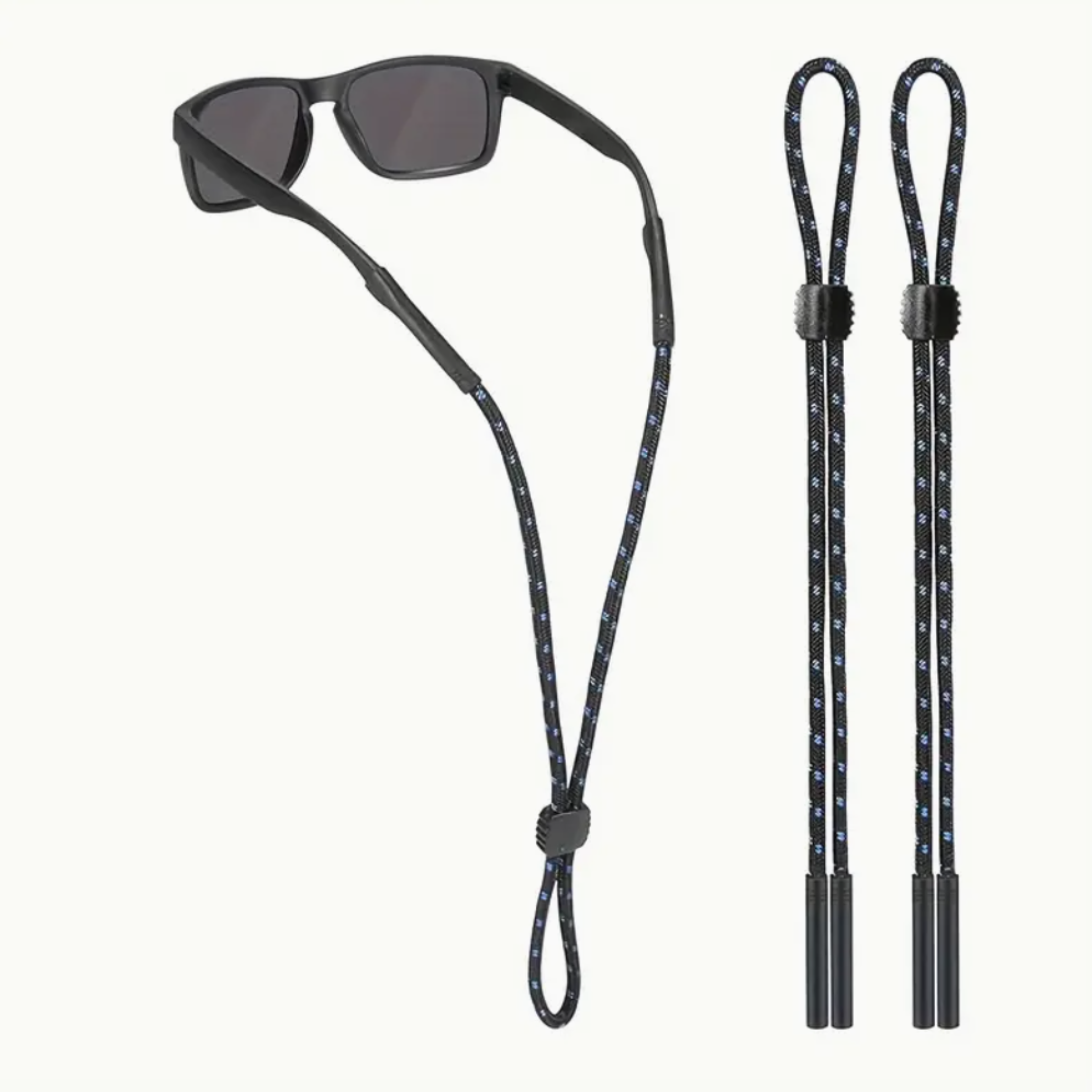 Sunglasses with a black cord and two additional black cords on a white background